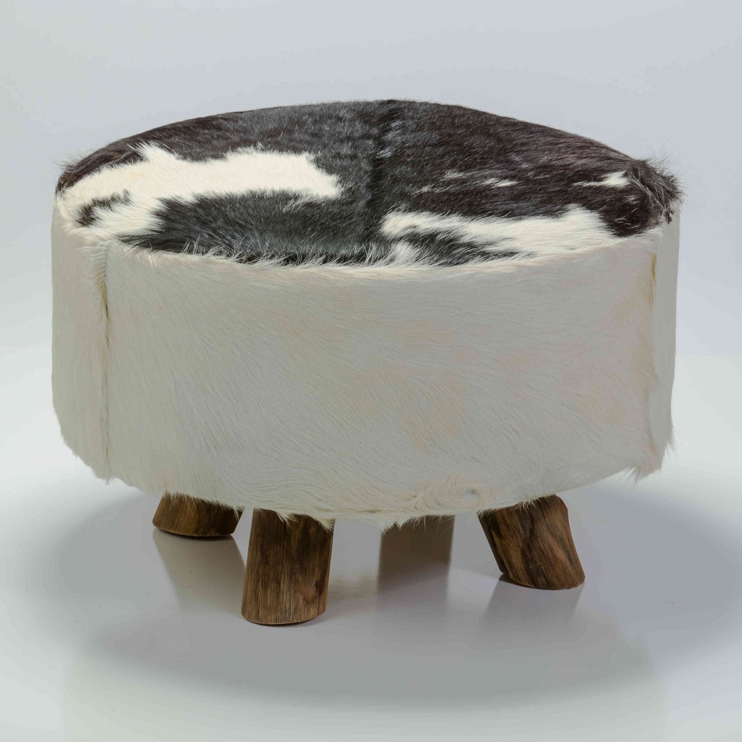 Bare Decor Cassidy Round Leather, Genuine Hide Ottoman in Black and White